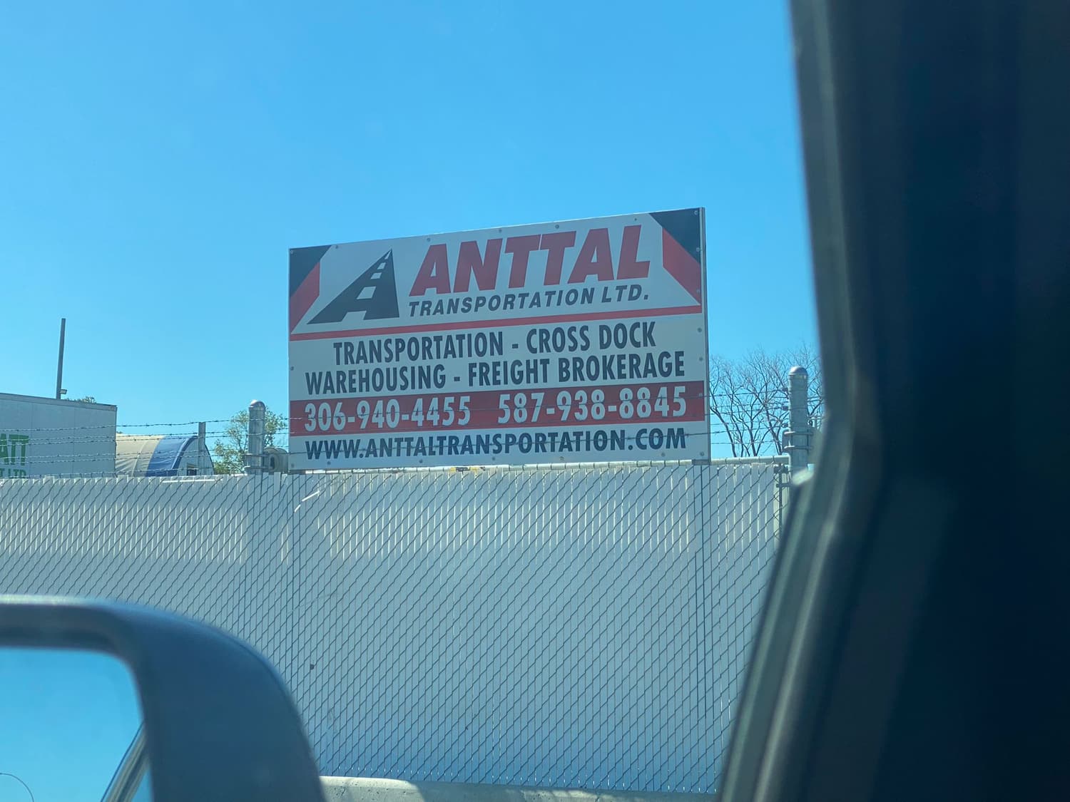 Anttal Transportation fence sign