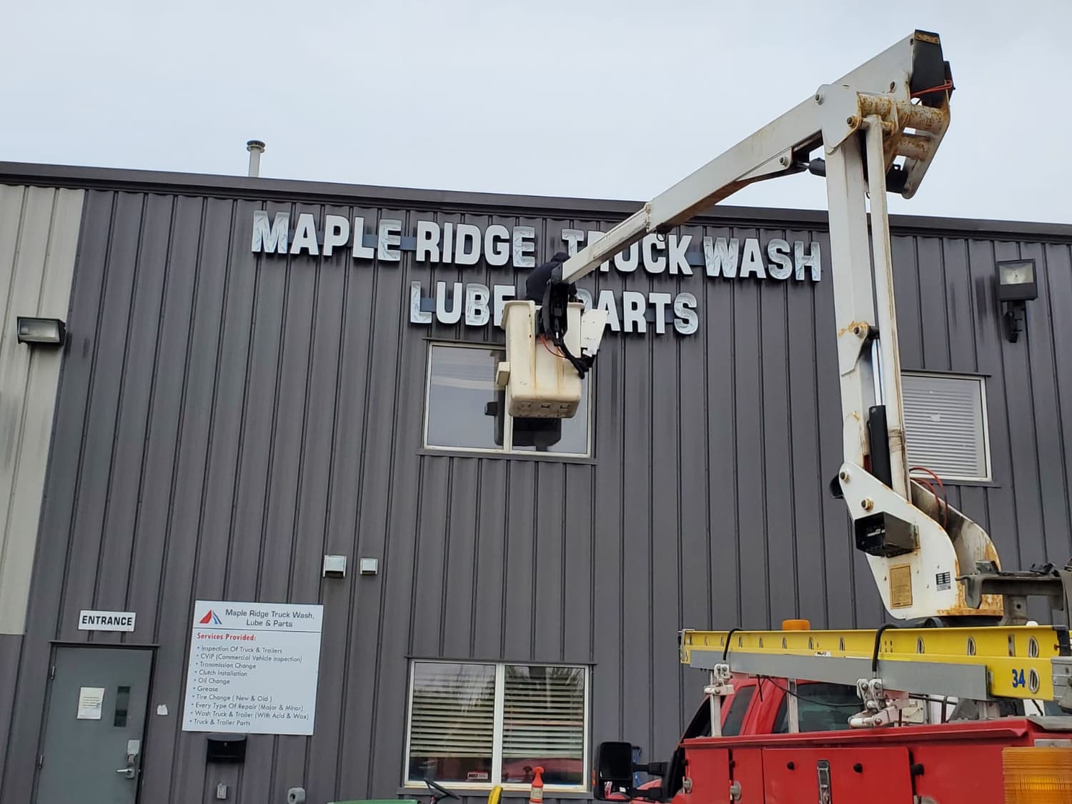 Installing dimensional letters at Maple Ridge Truck Wash