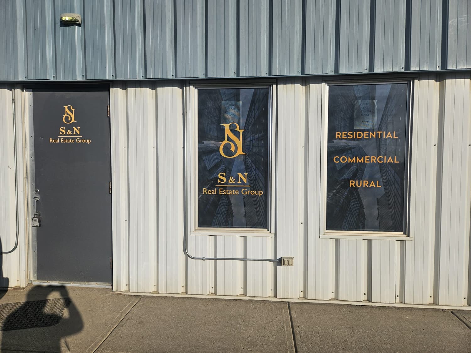 S and N Real Estate Group gold window and door lettering
