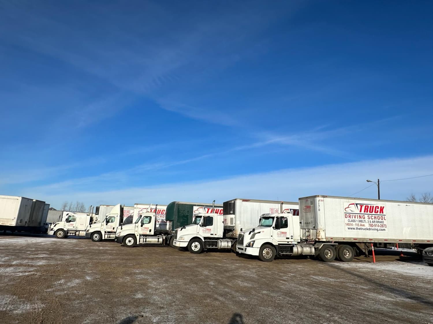 Fleet of truck driving school trucks and trailers